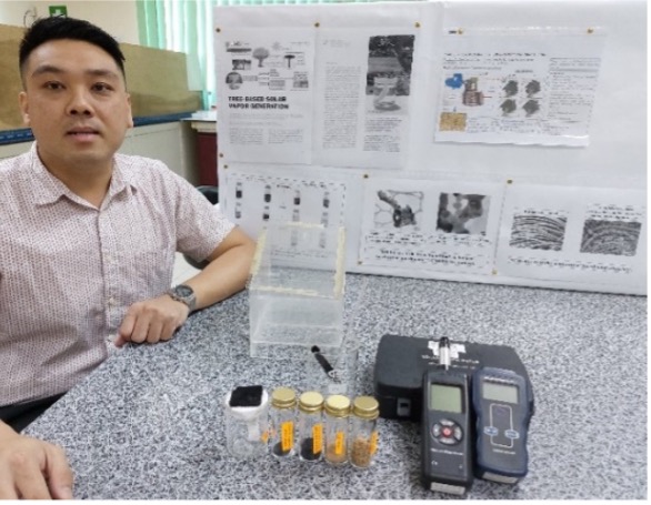 Assoc. Prof. Ir. Ts. Dr. Melvin Gan Jet Hong with the lab-scale solar vapor generator Image
